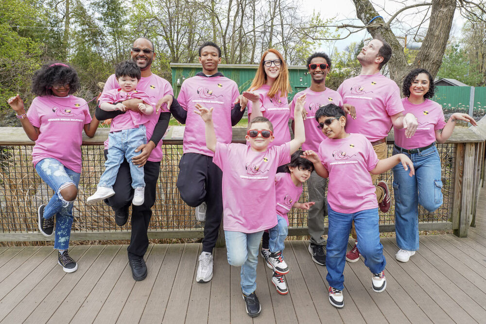 group of people in Summer Break Baltimore t-shirts having fun, posing like flamingoes