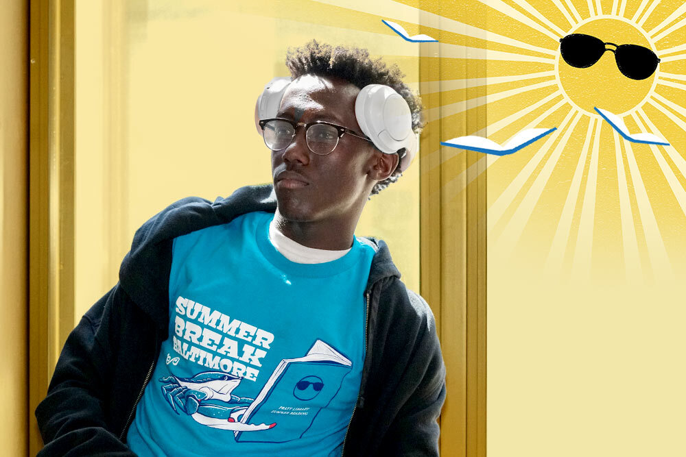 Summer Break Baltimore 2024 - teen guy with blue t-shirt and gold sun