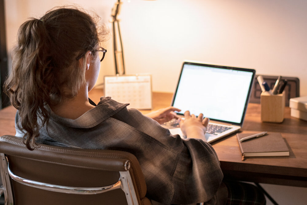 teen using a laptop for homework research