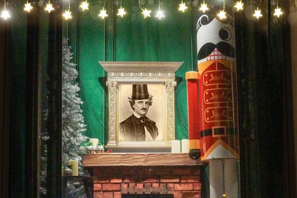 New year at the Pratt Library - winter window scene with Edgar Allan Poe in a top hat, and Mr. Boh as a nutcracker