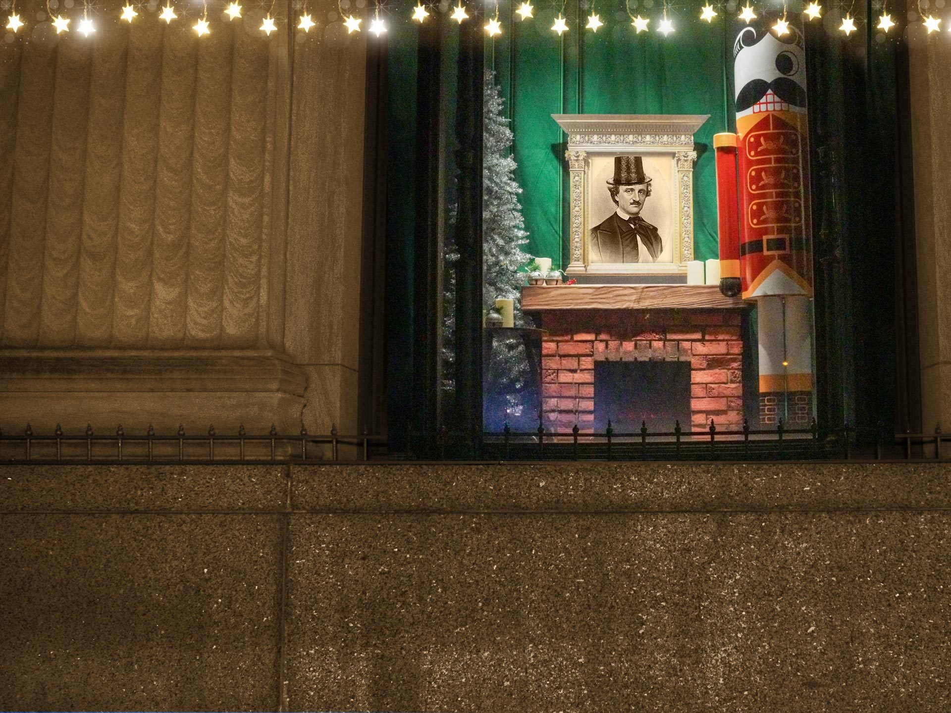 New year at the Pratt Library - winter window scene with Edgar Allan Poe in a top hat, and Mr. Boh as a nutcracker