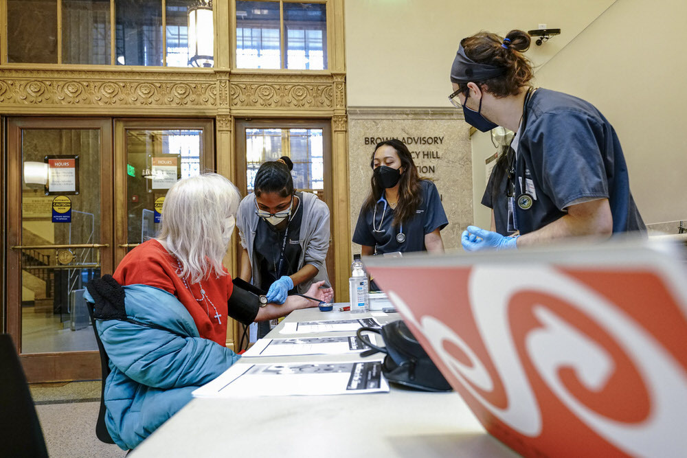 Wellness in the Library - nurses at a Central Library table