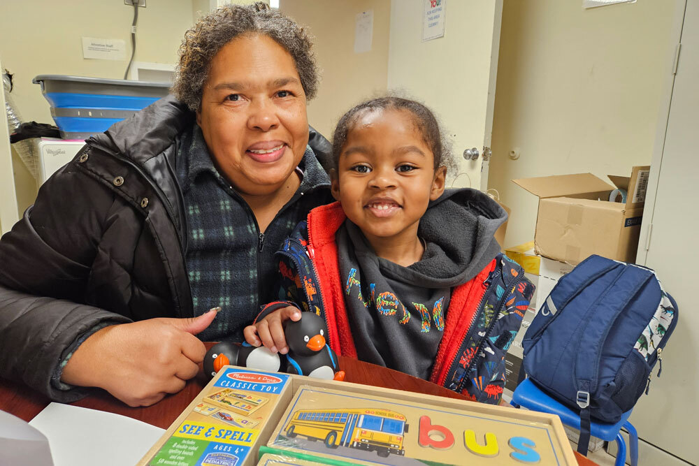 Books for Me - young child and adult with bus themed learning toys