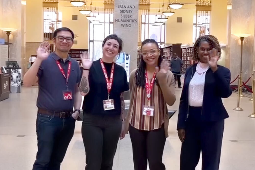 Social workers staff group waving in Central Library