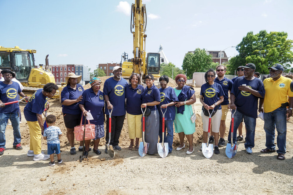 Johnston Square Branch groundbreaking with ReBuild community members holding shovels