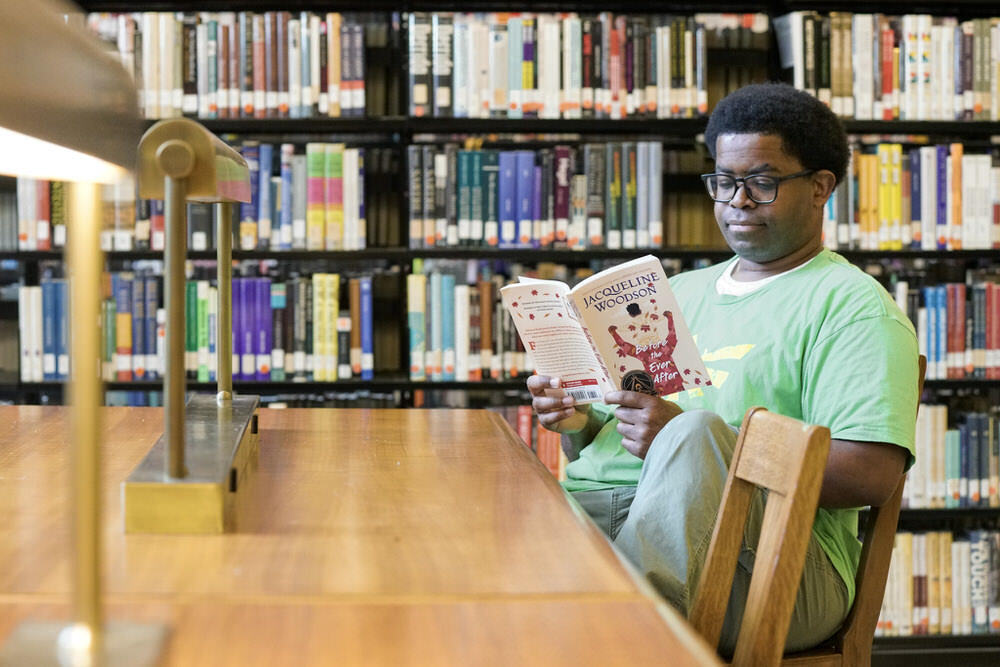 One Book Baltimore 2023 - a teen reading Before The Ever After book by Jacqueline Woodson