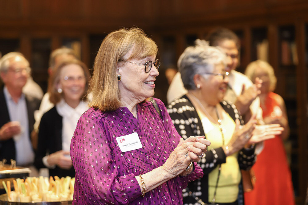 Pratt Society event with Sayra Meyerhoff and other guests applauding