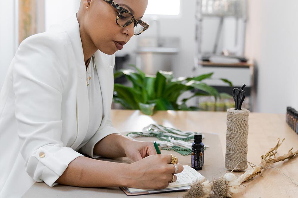 Artist in residence Phylicia Ghee working at a desk. Photo by Anne Kim, courtesy of The Nicholson Project