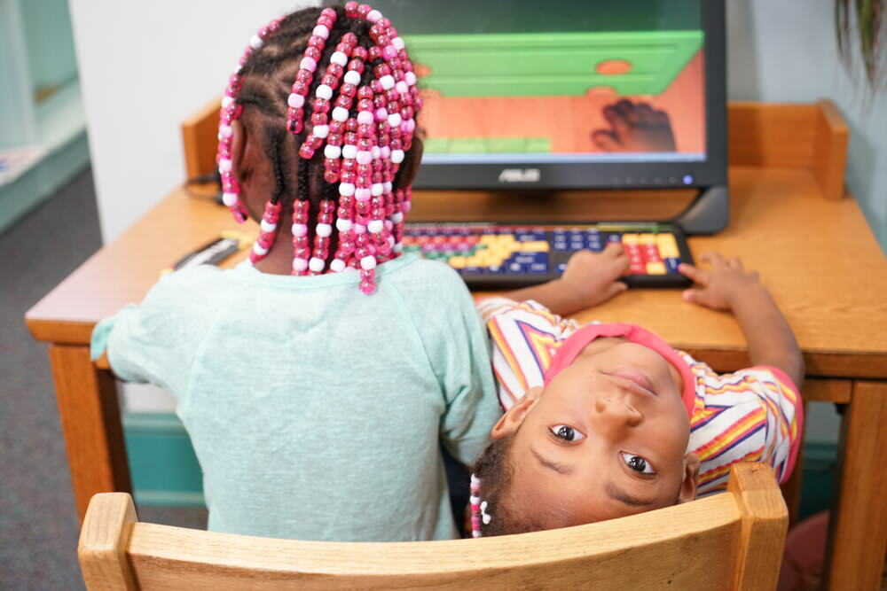 girls at a children's computer