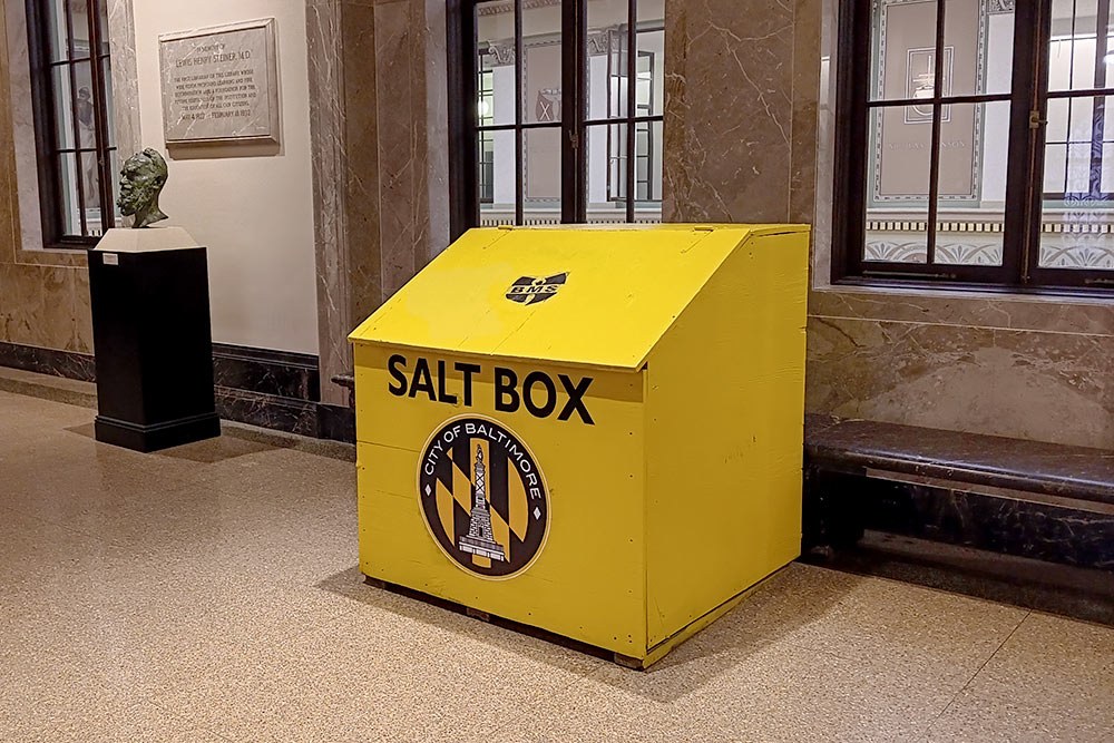 Salt Box - oversized Baltimore City salt box in the library hallway, with City emblem