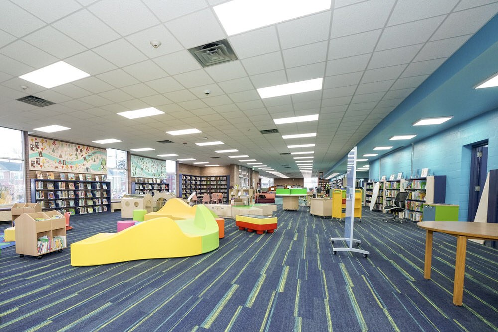 Herring Run after 2024 renovation - wide room view with colorful furniture